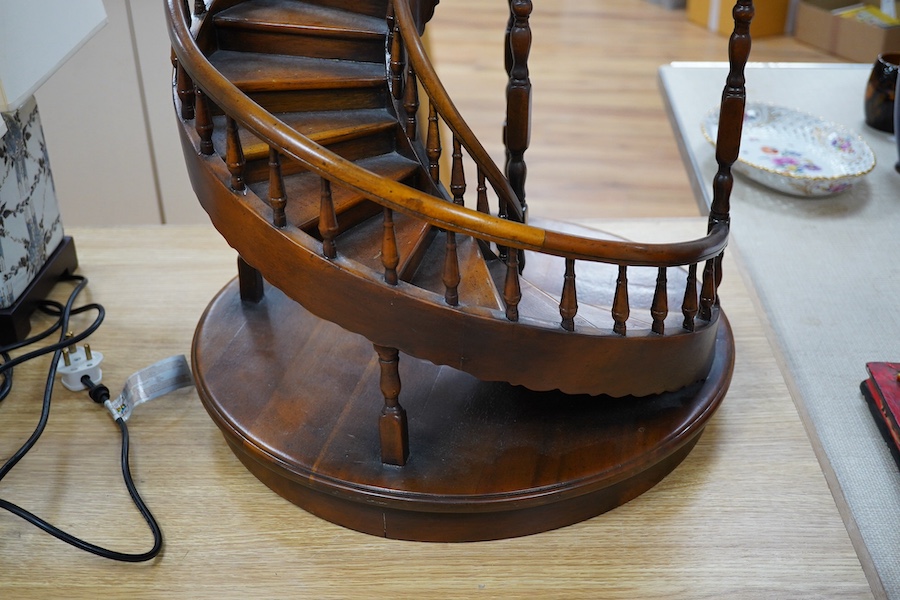 A scale model hardwood spiral staircase, 106cm tall. Condition - good